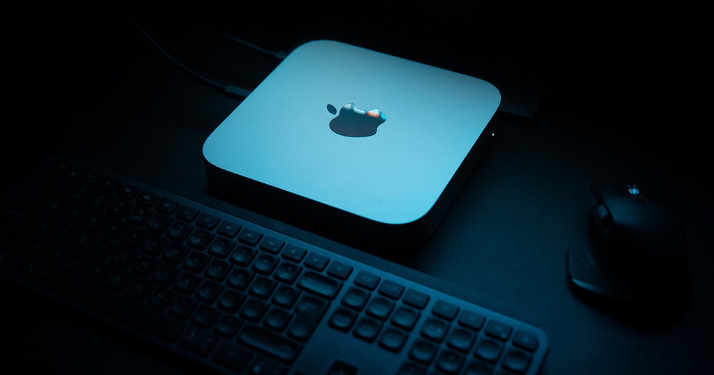 Mac mini in glow of display light