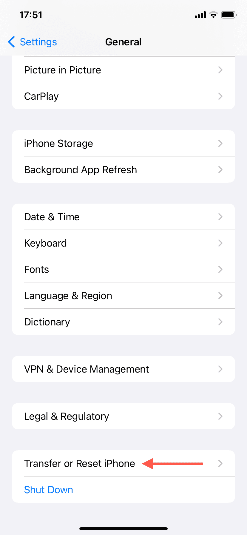 The Transfer & Reset iPhone option highlighted in General settings.