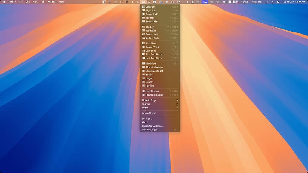 macOS 15 Sequoia desktop showing the default wallpaper and the Rectangle app menu