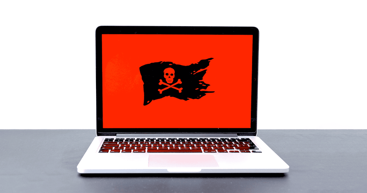 MacBook Pro displaying a pirate flag over a red background