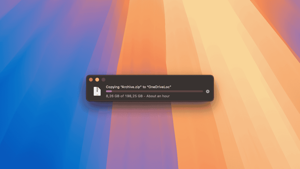 macOS Sequoia default wallpaper with a file transfer dialog